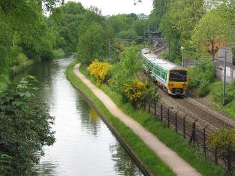 Class 323 electric multiple unit train, running along Worcester and Birmingham Canal